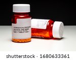 Hydroxychloroquine (Chloroquine) Pills, Generic For Plaquenil On Split Black/White Background.