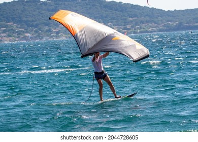 Hyeres, France, 10 July 2021, extreem water sports - wing foil, kite surfing, wind surfindg, windy day on Almanarre beach near Toulon, South of France