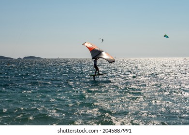 Hyeres, France, 10 July, 2021. Extreem water sports - wing foil, kite surfing, wind surfindg, windy day on Almanarre beach near Toulon, South of France
