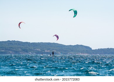 Hyeres, Provence, France, 10 July 2021. Extreem water sports - wing foil, kite surfing, wind surfindg, windy day on Almanarre beach near Toulon, South of France