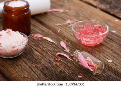 hygiene, beauty products, pink soap, cream, bath salt, tincture, old wooden table background - Shutterstock ID 1389347006