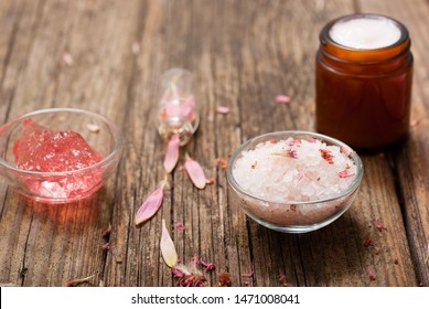 hygiene, beauty products, pink soap, cream, bath salt, tincture, old wooden table background - Shutterstock ID 1471008041