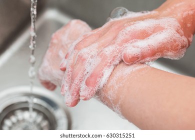 Hygiene. Cleaning Hands. Washing hands with soap - Shutterstock ID 630315251