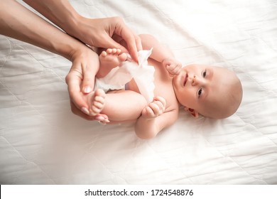 Hygiene Cleaning Wipe, Pure, Clean. Mother Cleaning Up And Wipes Body And Leg Baby By Wet Tissue.