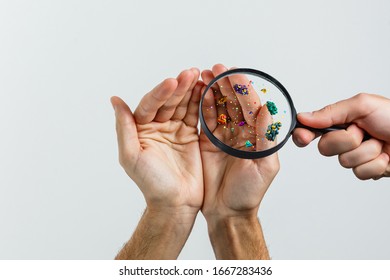 Hygiene concept. Man is showing dirty hands with many viruses and germs. - Shutterstock ID 1667283436