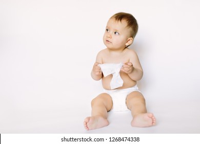 Hygiene - Little Baby Girl Get Wet Wipes, And Wipes Her Face Isolated On White Background. Cleaning Wipe, Pure, Clean