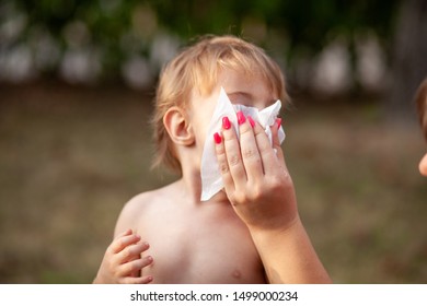 Hygiene - Mom Wiping The Baby Nose And Face With Wet Wipes. Cleaning Wipe, Pure, Clean, Outdoor