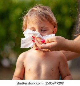 Hygiene - Mom Wiping The Baby Nose And Face With Wet Wipes. Cleaning Wipe, Pure, Clean, Outdoor