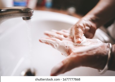 Hygiene for prevent virus corona infrection concept. Asian eldery woman washing hand by foam soap after go work outside. Personal self care for protect family. - Powered by Shutterstock