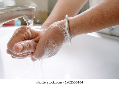 Hygiene For Prevent Virus Covid Infrection Concept. Asian Eldery Woman Washing Hand By Foam Soap After Go Work Outside. Personal Self Care For Protect Family.