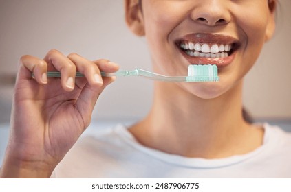 Hygiene, woman and smile for brushing teeth for oral wellness, healthcare and orthodontics in home. Girl, whitening toothpaste and brush for cleaning mouth, fresh breath and healthy gums or veneers - Powered by Shutterstock