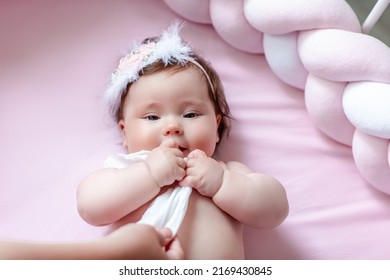 Hygiene - Young Mom Wiping The Baby Skin Body And Face With Wet Wipes Carefully On Pink Background. Concept Cleaning Wipe, Pure, Clean.