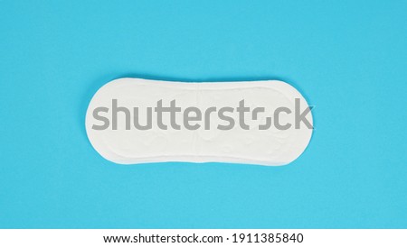 Hygienic daily panty liner isolated on blue background. no people.