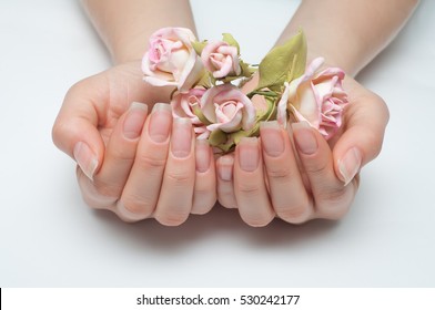 Hygienic Manicure On Natural Healthy Nails And Flowers In The Palms 