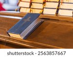 Hymnal and bible on a pew in a church