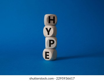 Hype symbol. Concept word Hype on wooden cubes. Beautiful blue background. Business and Hype concept. Copy space.