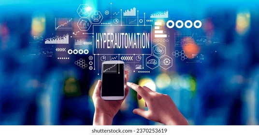 Hyperautomation theme with person using a smartphone in a city at night
