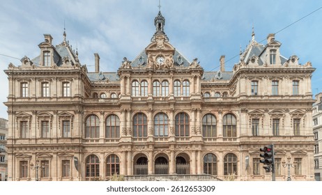 Hyperlapse of Palais de la Bourse (Palais du Commerce) front view in the Les Cordeliers quarter, Lyon, France. A historic 19th-century building with traffic passing on the street timelapse