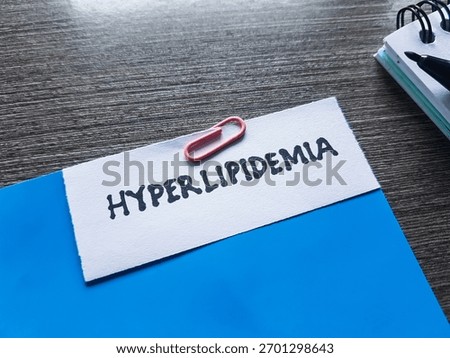 Hyperlipidemia writting on table background.