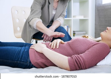 Hypnosis Being Practiced On Young Woman Patient 