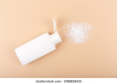 Hypoallergenic baby powder on light beige background