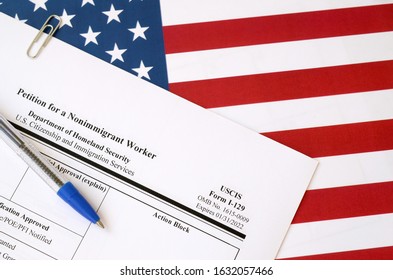 I-129 Petition For A Nonimmigrant Worker Blank Form Lies On United States Flag With Blue Pen From Department Of Homeland Security