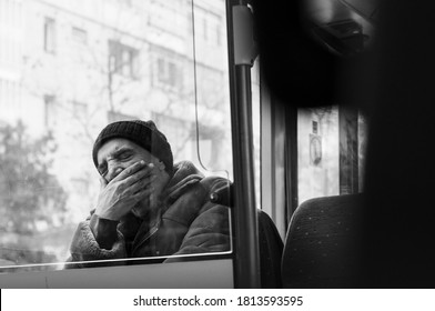 Iasi, Romania - 22 November 2011: Black And White Photograph Of A Old Man Yawning In Bus 