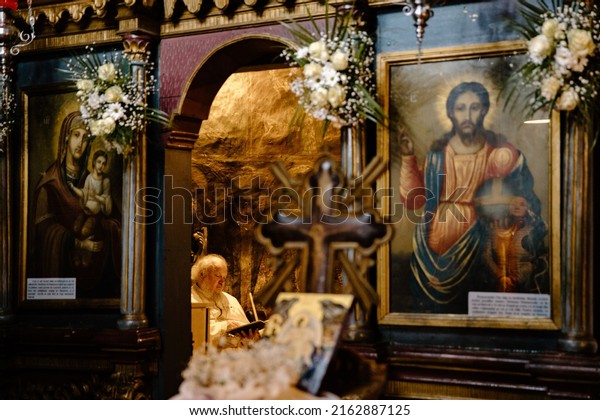 Iasi, Romania - April 23\
2022: Orthodox priest waiting in the altar before the religious\
service.