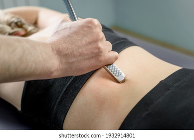 IASTM Treatment, Girl Receiving Soft Tissue Treatment On Her Neck With Stainless Steel Tool