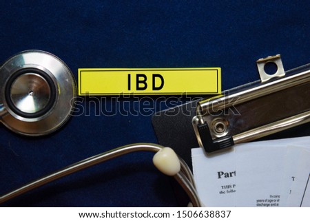 IBD text on sticky notes and stethoscope isolated on office desk. Heathcare/medical concept
