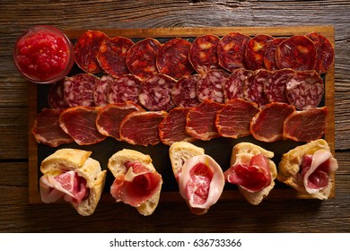 Iberian sausages and ham board Tapas from spain - Shutterstock ID 636733366