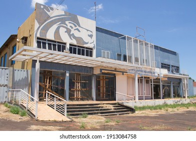 Ibitinga, SP, Brazil - Feb 09 2021: Facade Of Abandoned College Building
With Wood Barricade On The Doors