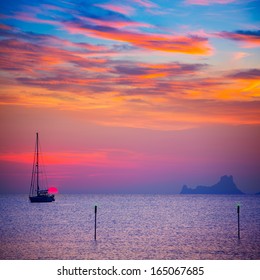 Ibiza sunset sun view from formentera Island with sailboat in Balearic Islands