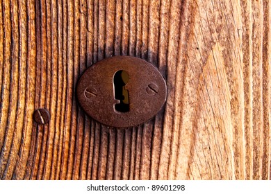 Ibiza Traditional Rusted Iron Key Hole On Weathered Wood