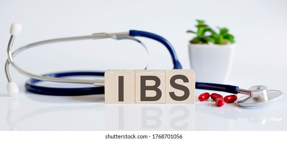 IBS The Word Is Written On Wooden Cubes And Sthetoscope And Piils . Medical Concept