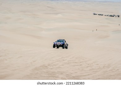 ICA, PERU - January 2013: Dakar Rally, Red Bull Buggy Team Crossing The Desert With Dunes.