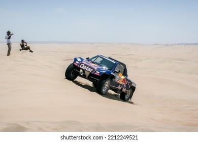 ICA, PERU - January 2013: Dakar Rally, Red Bull Buggy Team Crossing The Desert With Dunes.