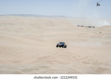 ICA, PERU - January 2013: Dakar Rally, Red Bull Buggy Team Crossing The Desert With Dunes.