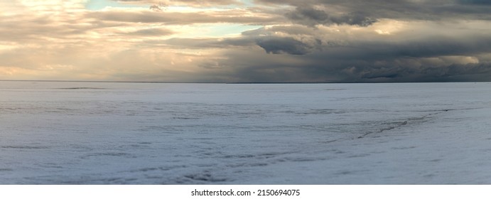 Ice Age, Panoramic Photo Frozen Sea And Severe Weather With Clouds. Soft Focus, Selective Focus