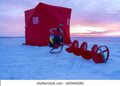 Ice Auger And Red Tent For Ice Fishing., Ice Fishing Is Popular Of Canadian.