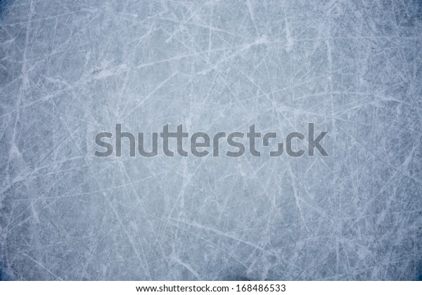 ice background with marks from skating and
hockey, blue texture