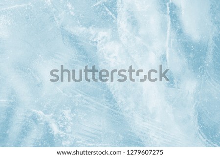 Ice background. Pattern of transparent shiny ice. Natural bright background