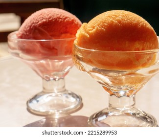 Ice Ball  In Cocktail Glass Tangerine And Cherry