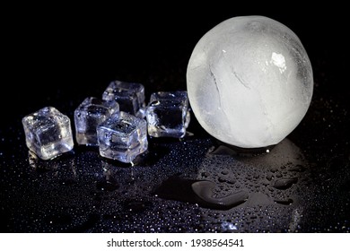 Ice Ball Reflection On Black Background.