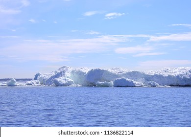 Ice berg surrounded by blue water at Baltic Sea, Finland