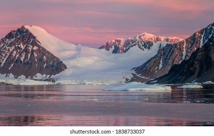 Ice Bergs At Sunset In Antartica