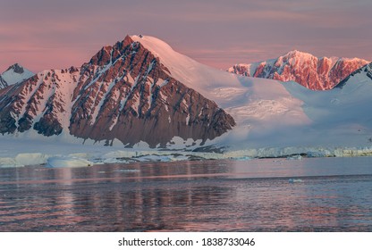 Ice Bergs At Sunset In Antartica