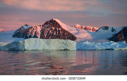 Ice Bergs At Sunset In Antartica