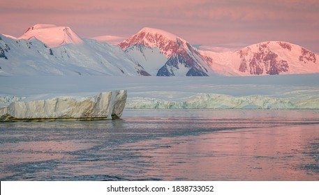 Ice Bergs At Sunset In Antartica