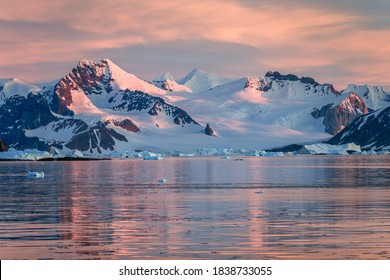 Ice Bergs At Sunset In Antartica